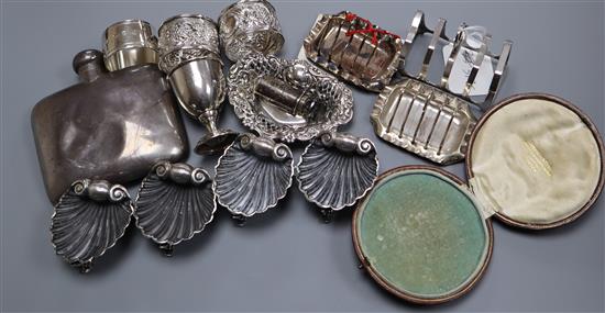 A set of late Victorian silver shell salts and other items including silver toastracks, silver napkin rings, silver hip flask etc.